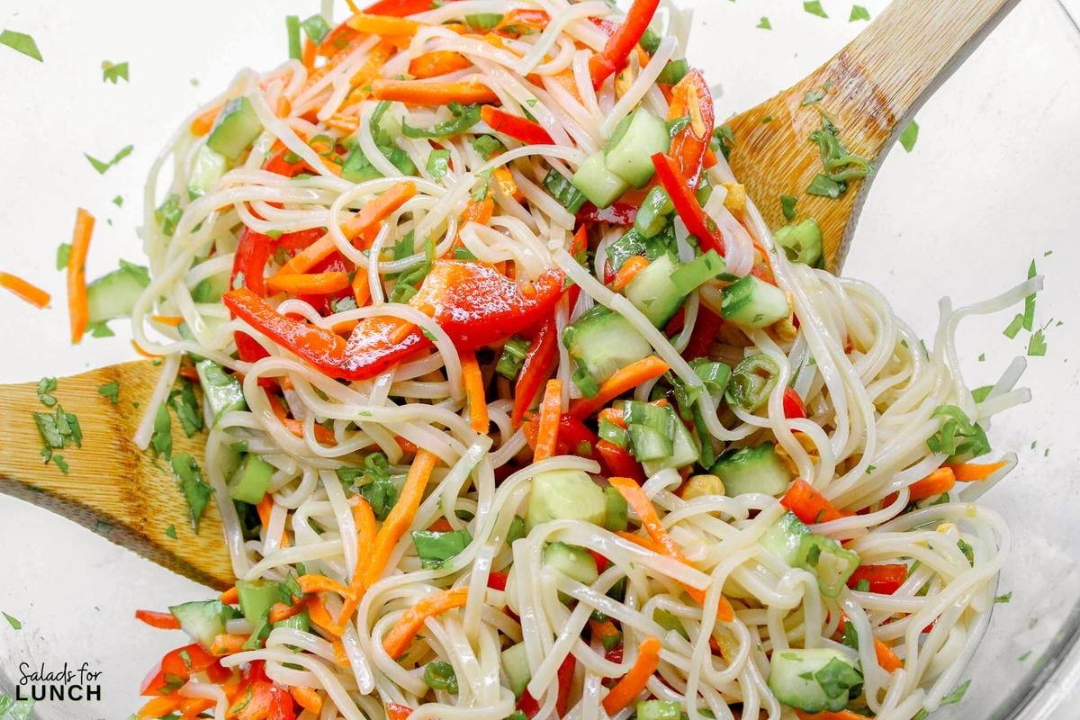 Rice Noodle Salad Recipe 9 - This refreshing salad features tender rice noodles tossed with crisp vegetables and a tangy sesame-lime dressing. It's perfect as a light main course or a flavorful side dish.