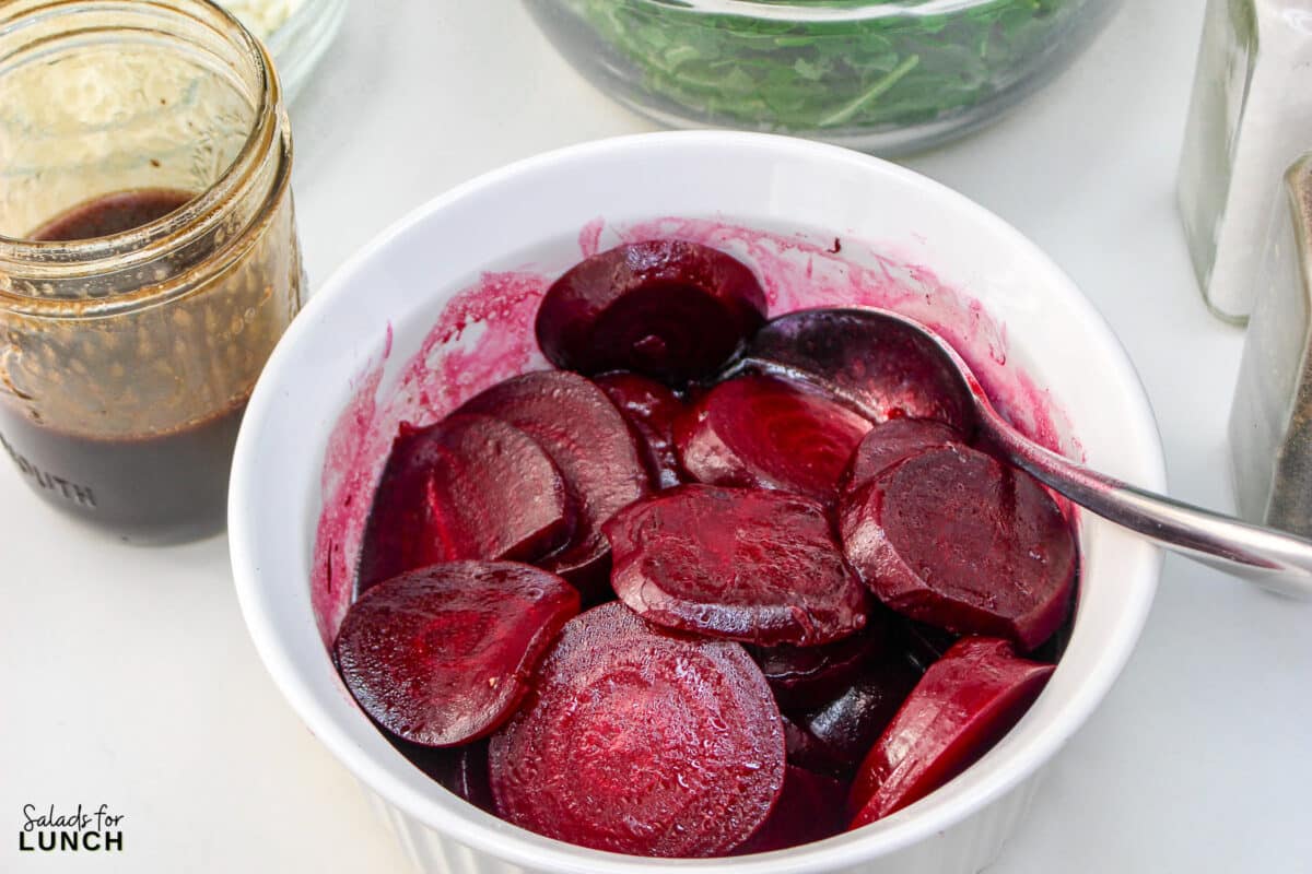 Roasted Beet Salad Recipe 10 1 - With the festive hues of red beets, green arugula, and golden slivered almonds, this Christmas salad recipe is a celebration of flavors and a feast for the eyes that will make your holiday spread merry and bright!