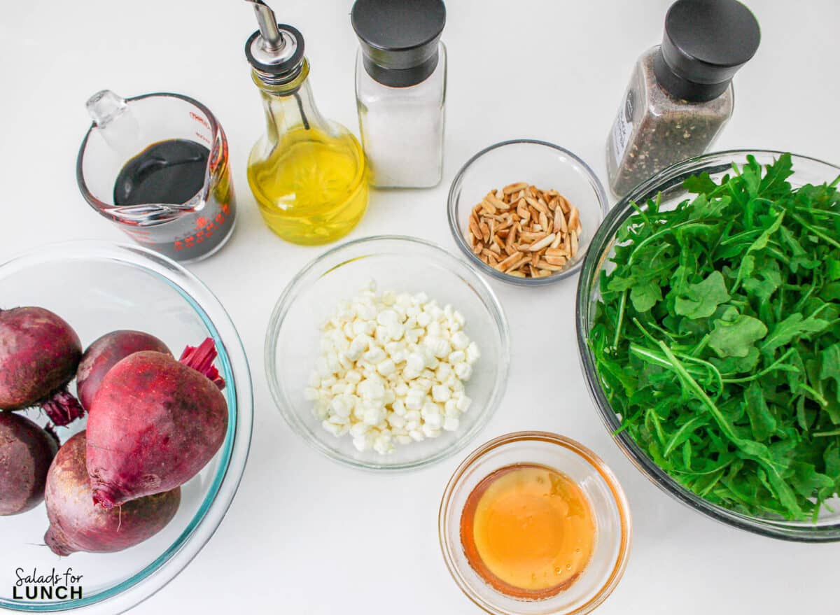 Roasted Beet Salad Recipe 2 1 - With the festive hues of red beets, green arugula, and golden slivered almonds, this Christmas salad recipe is a celebration of flavors and a feast for the eyes that will make your holiday spread merry and bright!