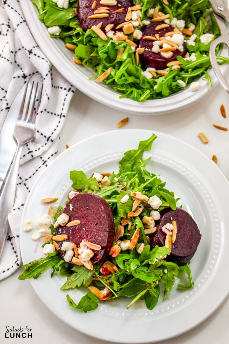 Roasted beets on a beg of greens topped with goat cheese and balsamic dressing.