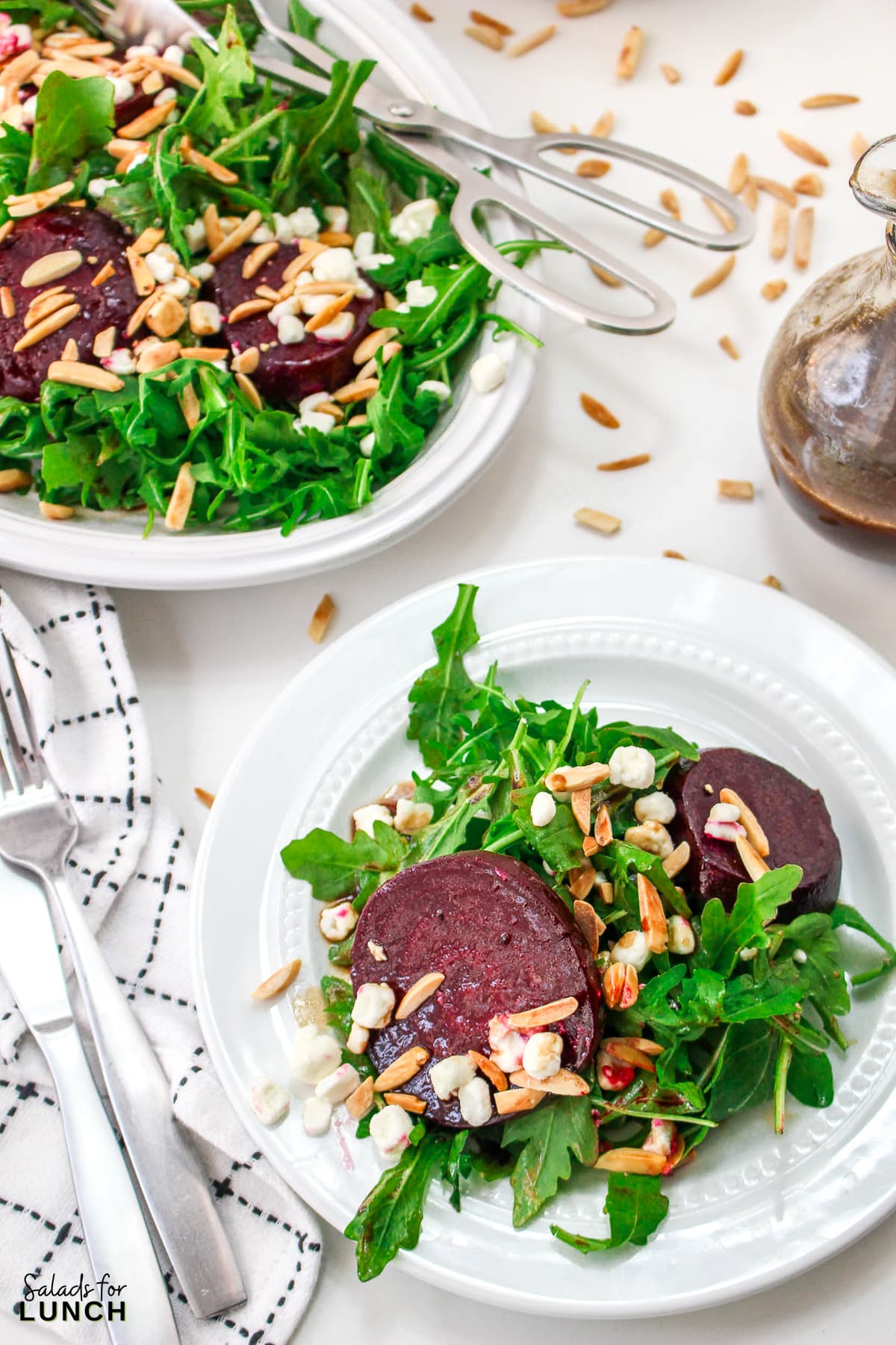 Roasted Beet Salad Recipe 30 1 - With the festive hues of red beets, green arugula, and golden slivered almonds, this Christmas salad recipe is a celebration of flavors and a feast for the eyes that will make your holiday spread merry and bright!