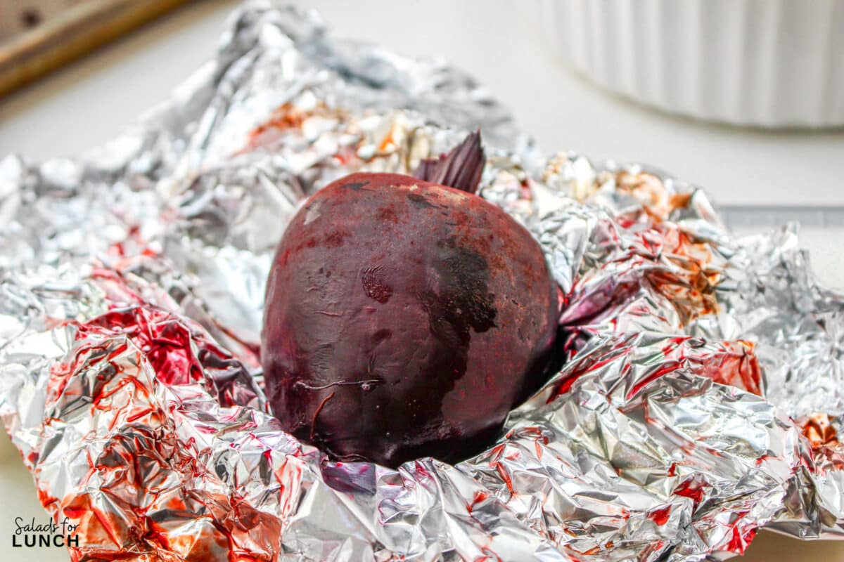 Roasted Beet Salad Recipe 8 1 - With the festive hues of red beets, green arugula, and golden slivered almonds, this Christmas salad recipe is a celebration of flavors and a feast for the eyes that will make your holiday spread merry and bright!