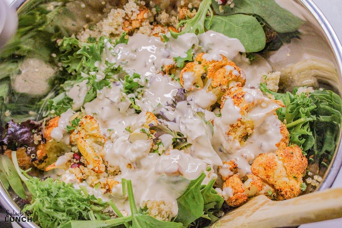 Roasted Cauliflower Salad Recipe 14 - This Roasted Cauliflower Salad with Lemon-Tahini Dressing is everything—golden roasted cauliflower, fresh greens, crunchy almonds, and a tangy, creamy dressing that ties it all together. Bonus: this salad is gluten-free, packed with veggies, and perfect for meal prep or your next dinner party.
