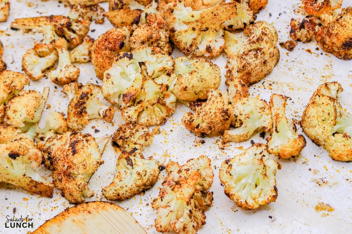 Roasted Cauliflower Salad Recipe 9 - This Roasted Cauliflower Salad with Lemon-Tahini Dressing is everything—golden roasted cauliflower, fresh greens, crunchy almonds, and a tangy, creamy dressing that ties it all together. Bonus: this salad is gluten-free, packed with veggies, and perfect for meal prep or your next dinner party.