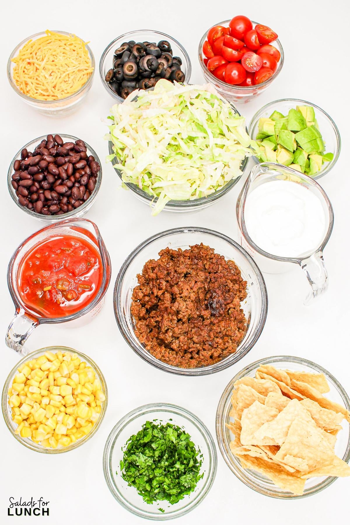 Seven Layer Taco Salad Recipe 1 - Imagine serving up a salad that has all the zest and heartiness of your favorite tacos but with the added benefit of a stunning presentation. This Seven Layer Taco Salad recipe is as easy to assemble as it is delicious, making it a go-to for busy weeknights and festive gatherings alike.