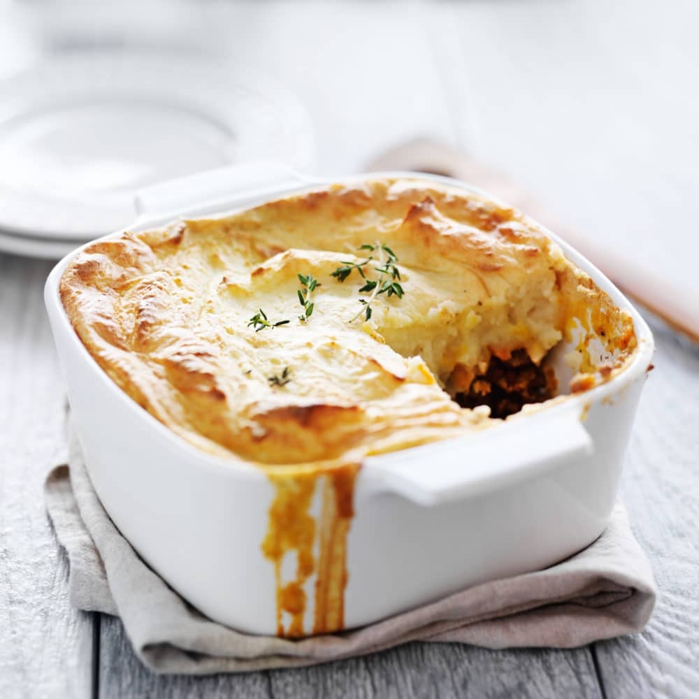 A simple version of the classic meat and vegetable comfort food casserole topped with cheesy garlic mashed potatoes, this is the best Shepherd's Pie recipe you'll ever make! #easyshepherdspie #casserole #gluten-free #groundbeef