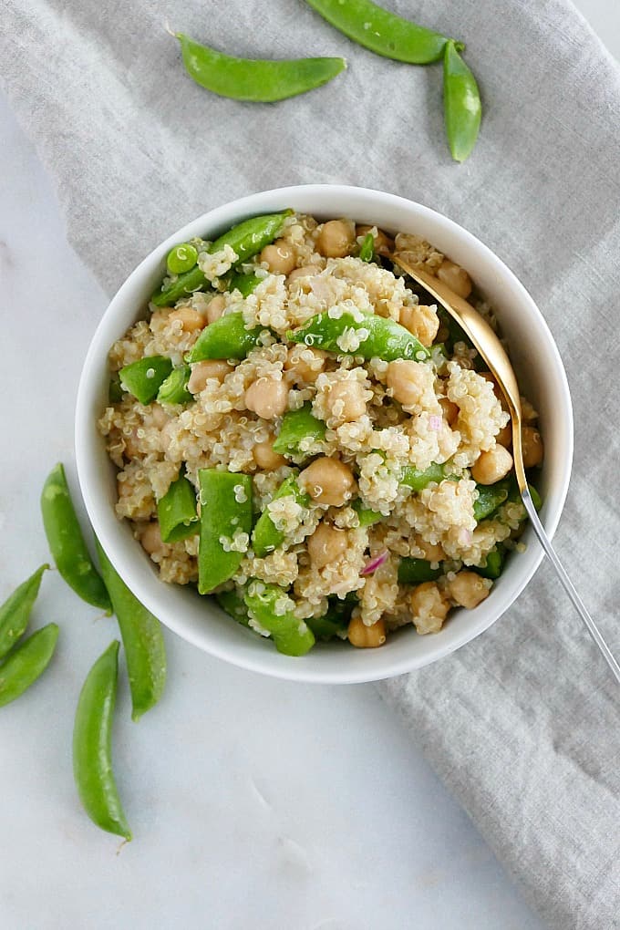 Snap Pea Quinoa Salad 1 - Let’s go keen-wah crazy with this tasty round-up of easy quinoa salad recipes to take to your next potluck! These delicious quinoa salad recipes are gloriously gluten-free with lots of vegetarian options too.