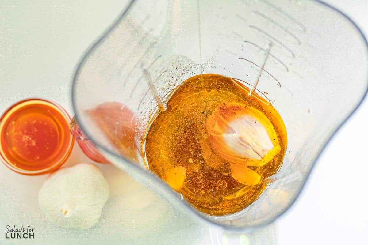 White balsamic dressing ingredients in a blender jar ready to be blended.