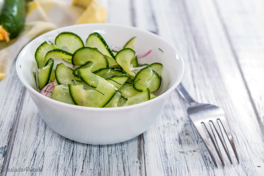 White bowl spiralized cucmber salad