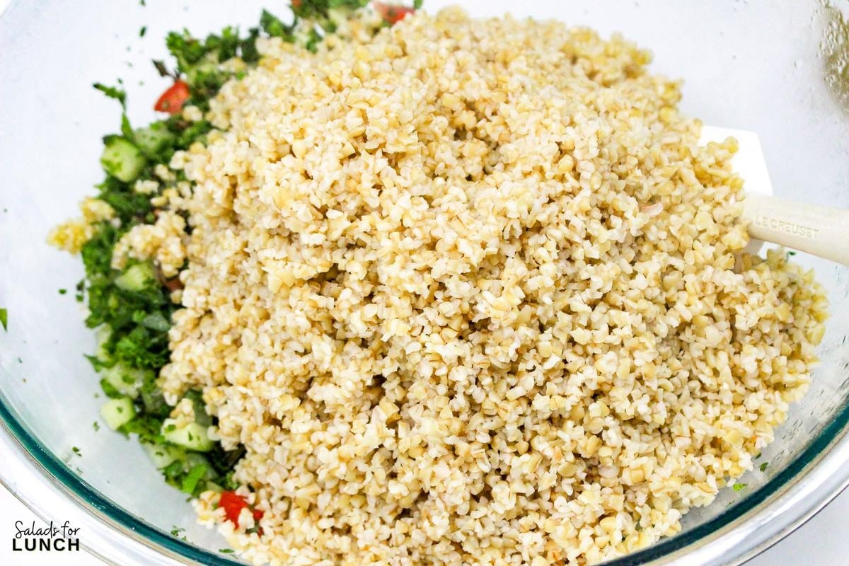 Tabbouleh Salad Recipe 12 - This refreshing Tabbouleh salad is made with bulgur wheat, fresh parsley, mint, tomatoes, and cucumbers, all tossed in a light lemon and olive oil dressing. It's a great option for a light meal or side dish.