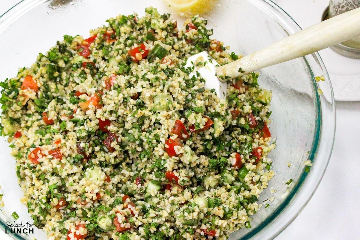 Tabbouleh Salad Recipe 14 - This refreshing Tabbouleh salad is made with bulgur wheat, fresh parsley, mint, tomatoes, and cucumbers, all tossed in a light lemon and olive oil dressing. It's a great option for a light meal or side dish.