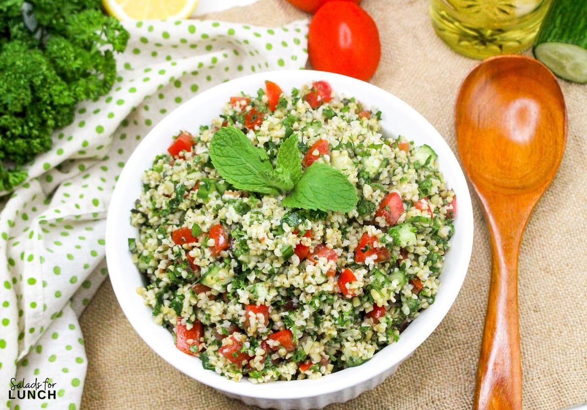 Tabbouleh Salad Recipe 16 - This refreshing Tabbouleh salad is made with bulgur wheat, fresh parsley, mint, tomatoes, and cucumbers, all tossed in a light lemon and olive oil dressing. It's a great option for a light meal or side dish.