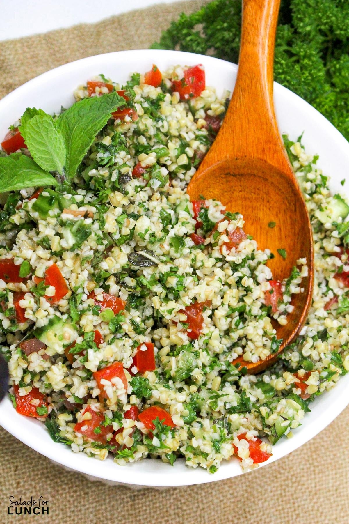 Tabbouleh Salad Recipe 23 - This refreshing Tabbouleh salad is made with bulgur wheat, fresh parsley, mint, tomatoes, and cucumbers, all tossed in a light lemon and olive oil dressing. It's a great option for a light meal or side dish.