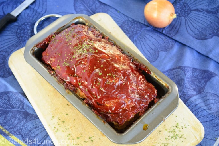 Turkey Meatloaf in loaf pan with onion
