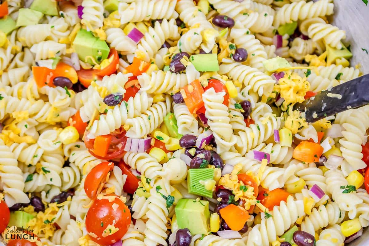 Vegetarian Mexican Pasta Salad 13 - You're going to love this Vegetarian Mexican Pasta Salad! Tender pasta is combined with Mexican-inspired flavors that's loaded with corn, black beans, tomatoes, jalapeño, cilantro, and a creamy lime dressing for a perfect summer time salad, great for barbecues, picnics, grilled meats or fish and more!