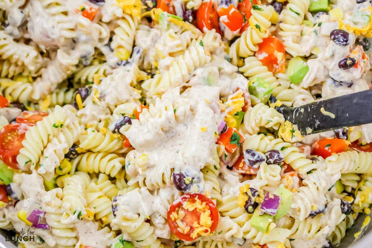 Vegetarian Mexican Pasta Salad 14 - You're going to love this Vegetarian Mexican Pasta Salad! Tender pasta is combined with Mexican-inspired flavors that's loaded with corn, black beans, tomatoes, jalapeño, cilantro, and a creamy lime dressing for a perfect summer time salad, great for barbecues, picnics, grilled meats or fish and more!