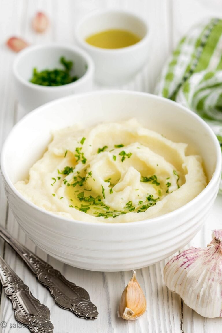 Close up of garlic parmesan mashed potatoes in a white bowl