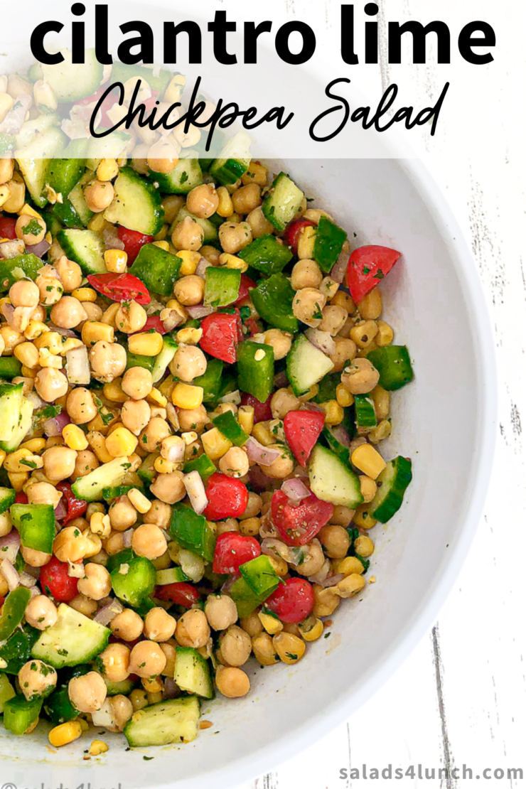 Cilantro lime chickpea salad in a white bowl on white wood countertop